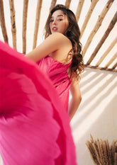Sleeveless pleated silk halter dress with ring-back detail and flowy midi silhouette